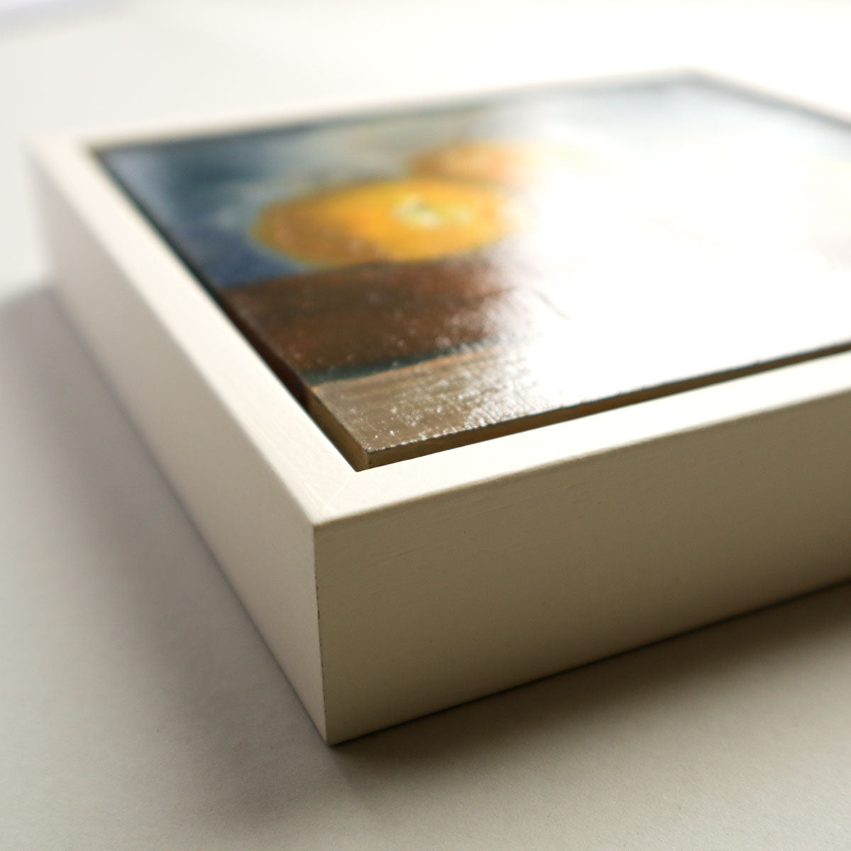 Yellow pears painting in custom tray frame showing frame depth and finish quality