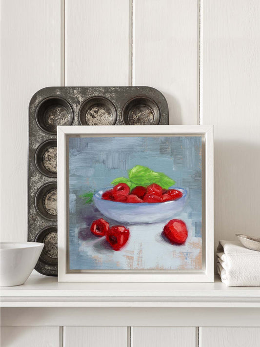 Raspberry oil painting displayed in kitchen interior as wall art.