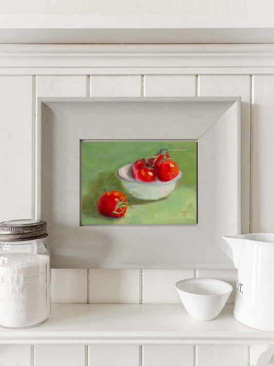 Tomato oil painting displayed in modern kitchen interior as wall art.