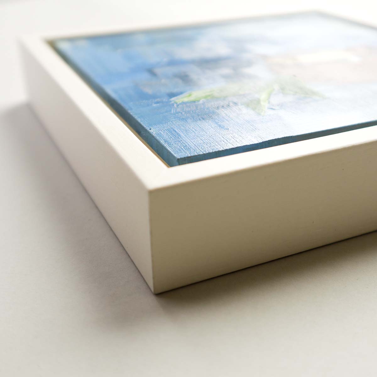Side view of teapot painting showing white tray frame depth and quality finish