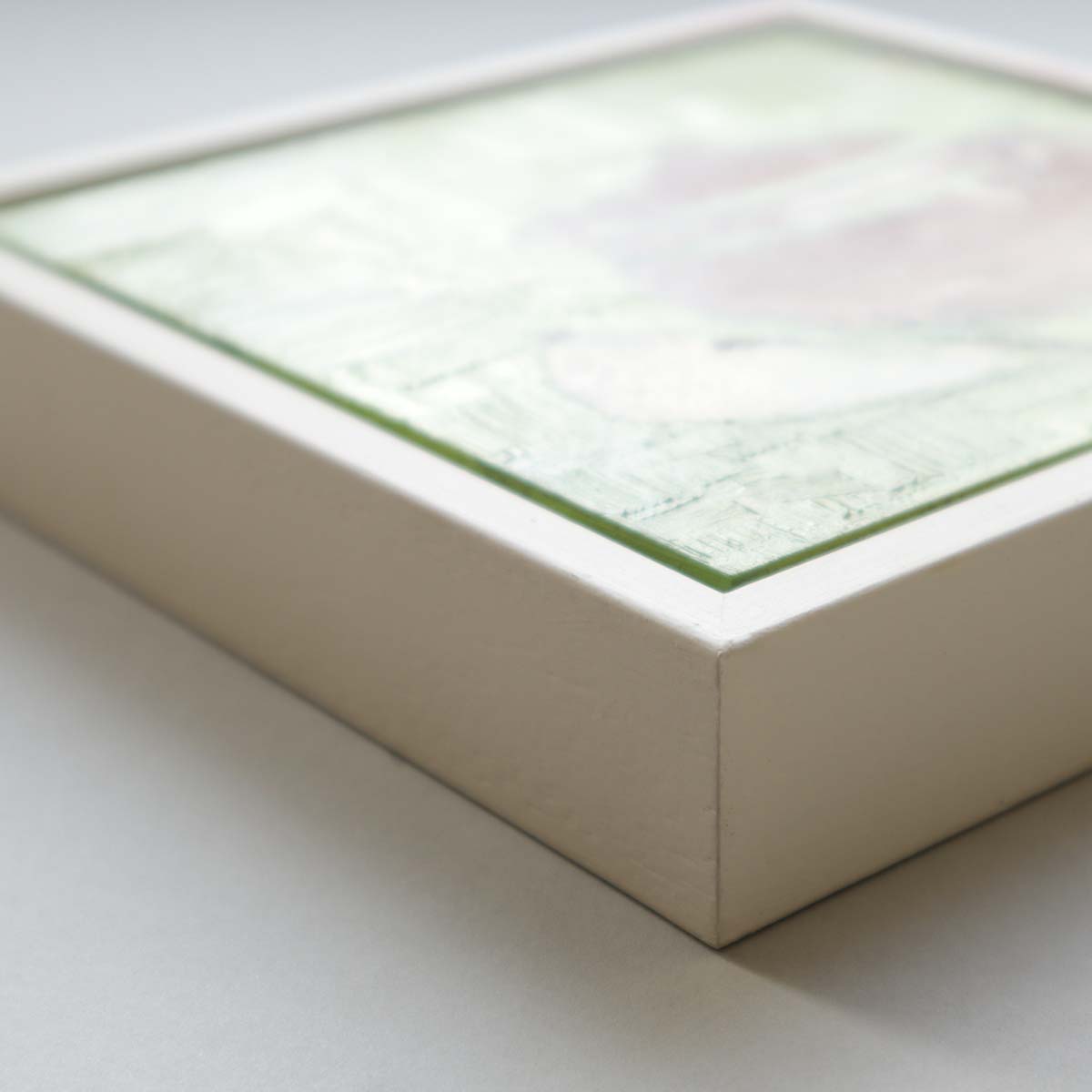 Side view of teapot painting showing white tray frame depth and quality finish