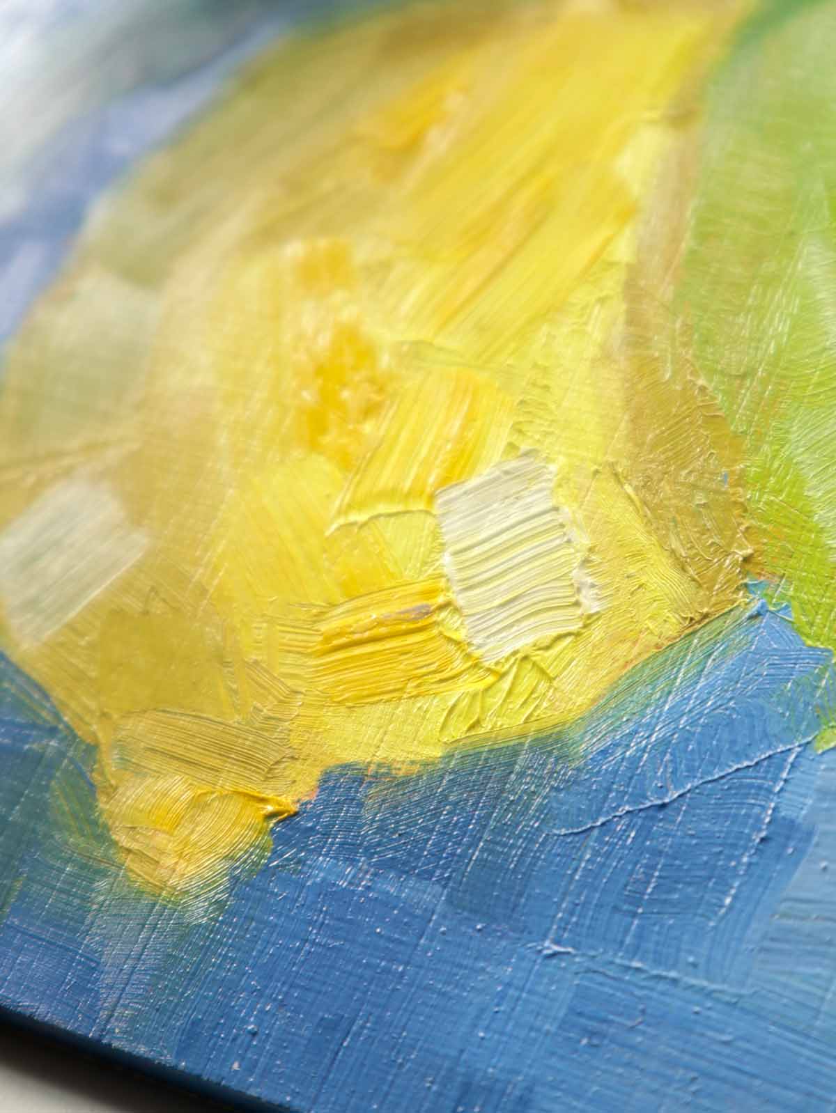 Close up of lemon painting showing brush strokes details