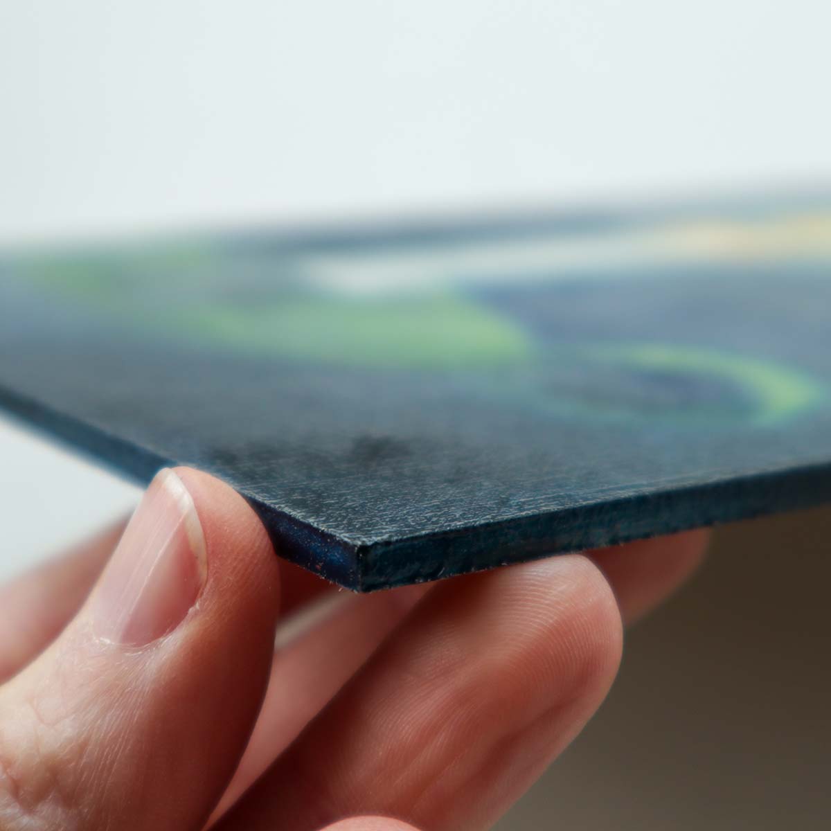 Candle painting shown at angle, showing thickness of painting board.