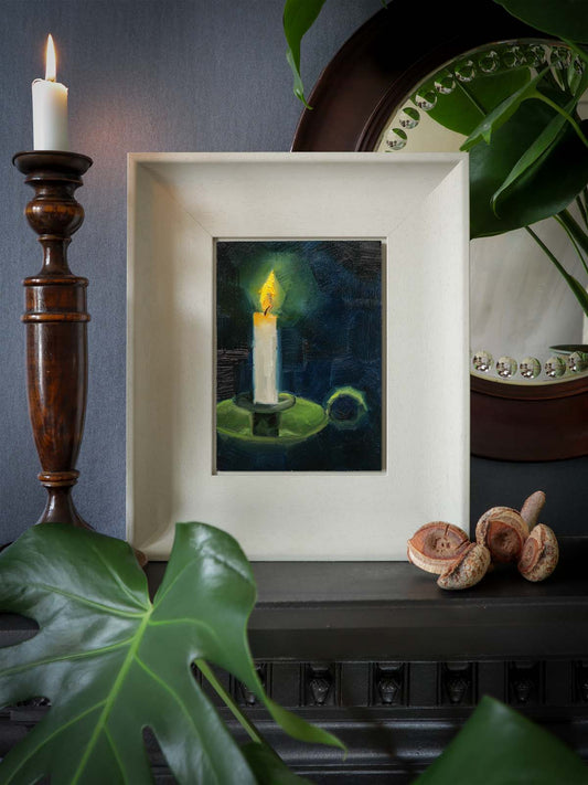 Small candle oil painting displayed in living room setting.