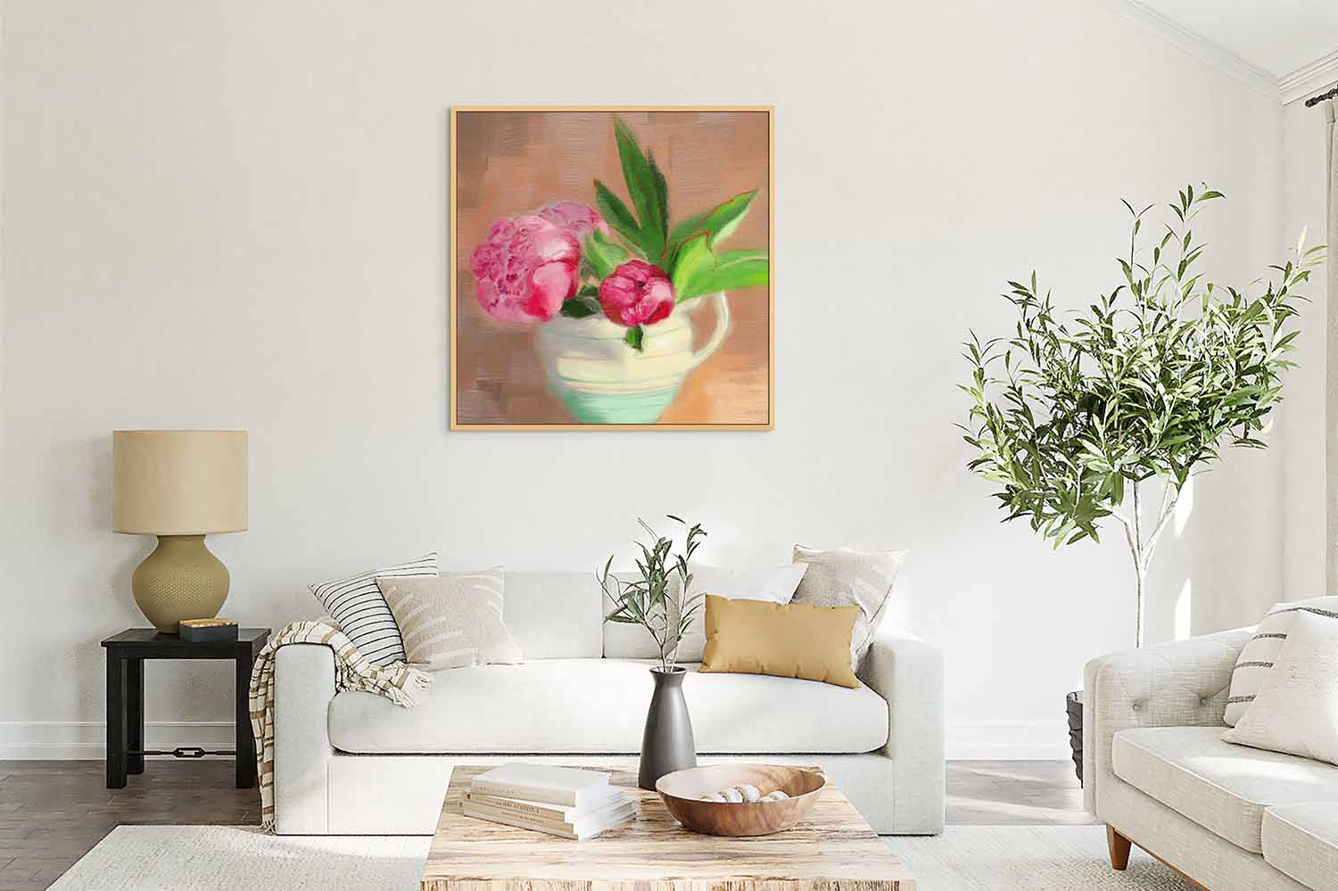Pink Peony canvas print in living room with a white sofa, coffee table, and plants.