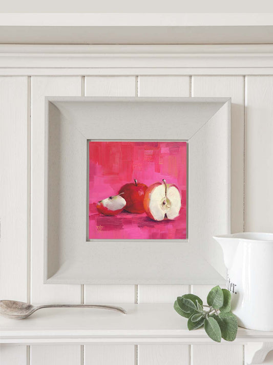 Apple painting in modern grey frame hanging on kitchen wall