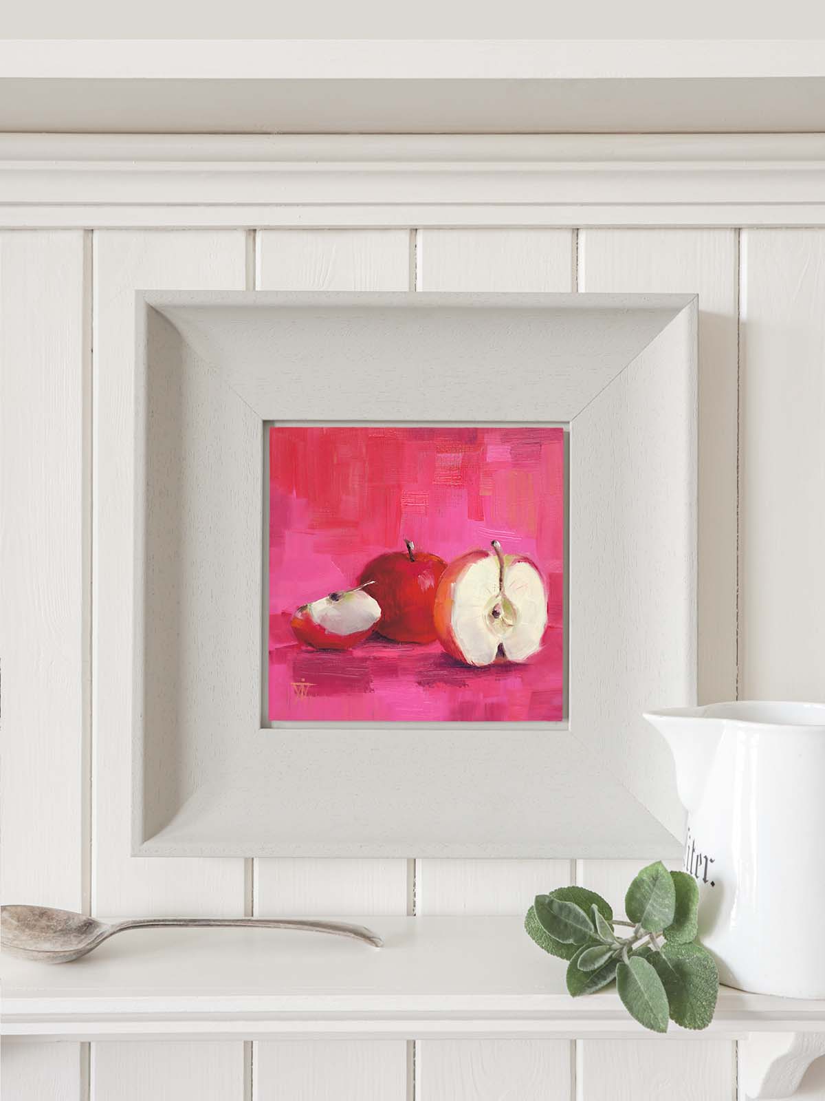 Apple painting in modern grey frame hanging on kitchen wall