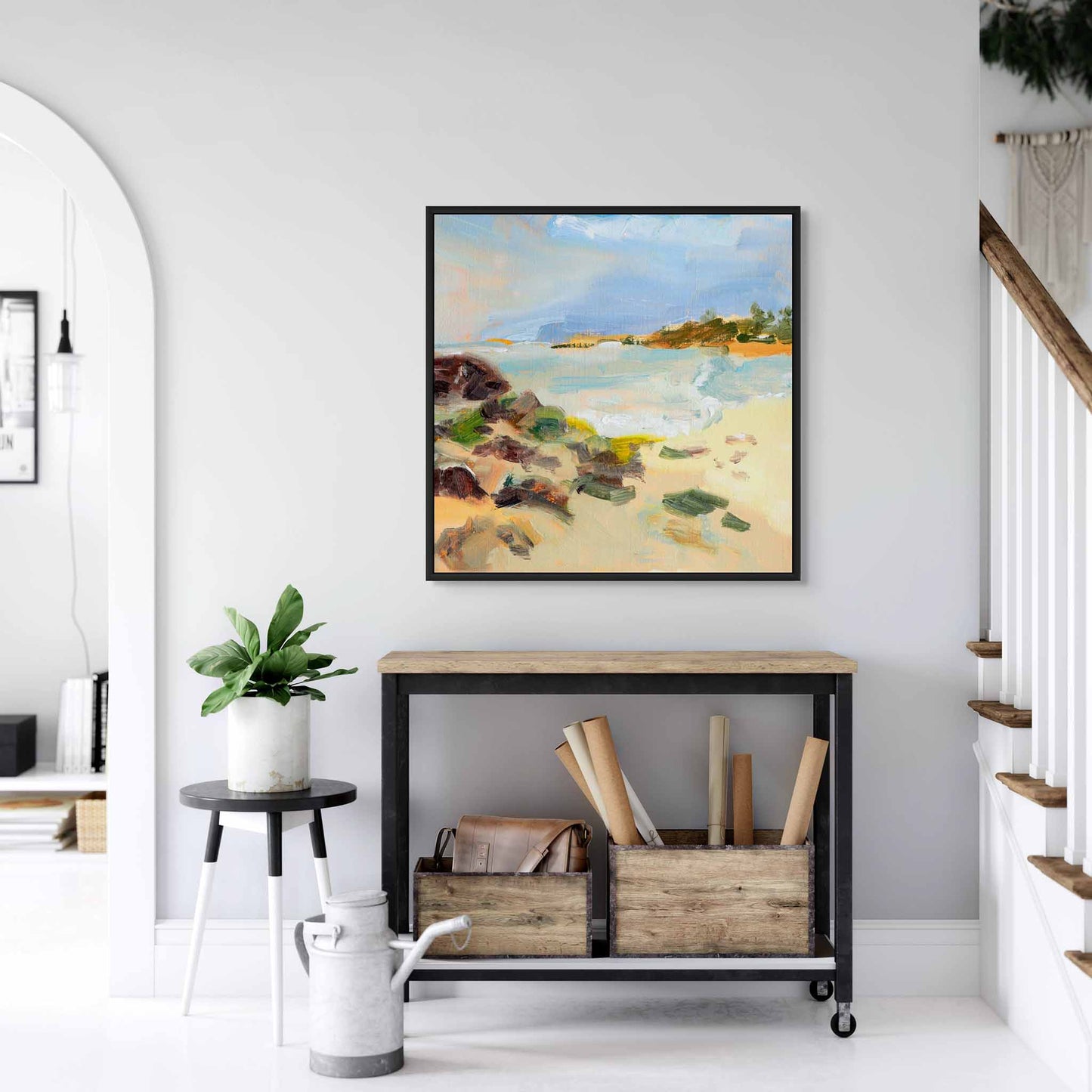 Coastal beach canvas art above a console table in hallway.