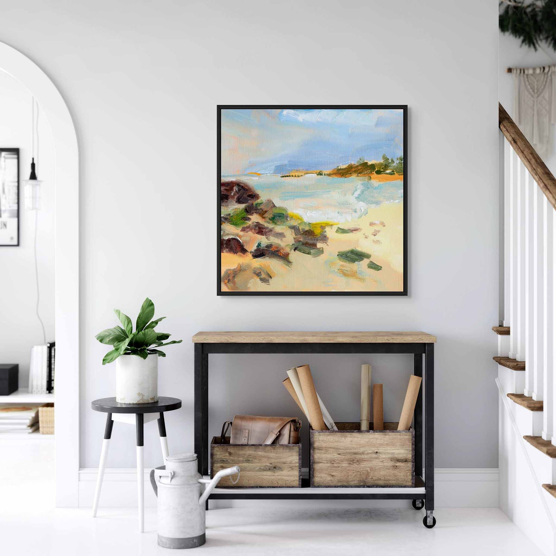 Coastal beach canvas art above a console table in hallway.