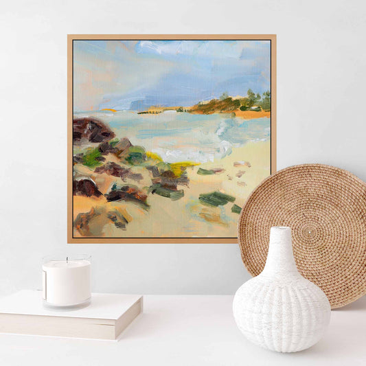 Peaceful canvas painting of coastal beach scene above sideboard in living room