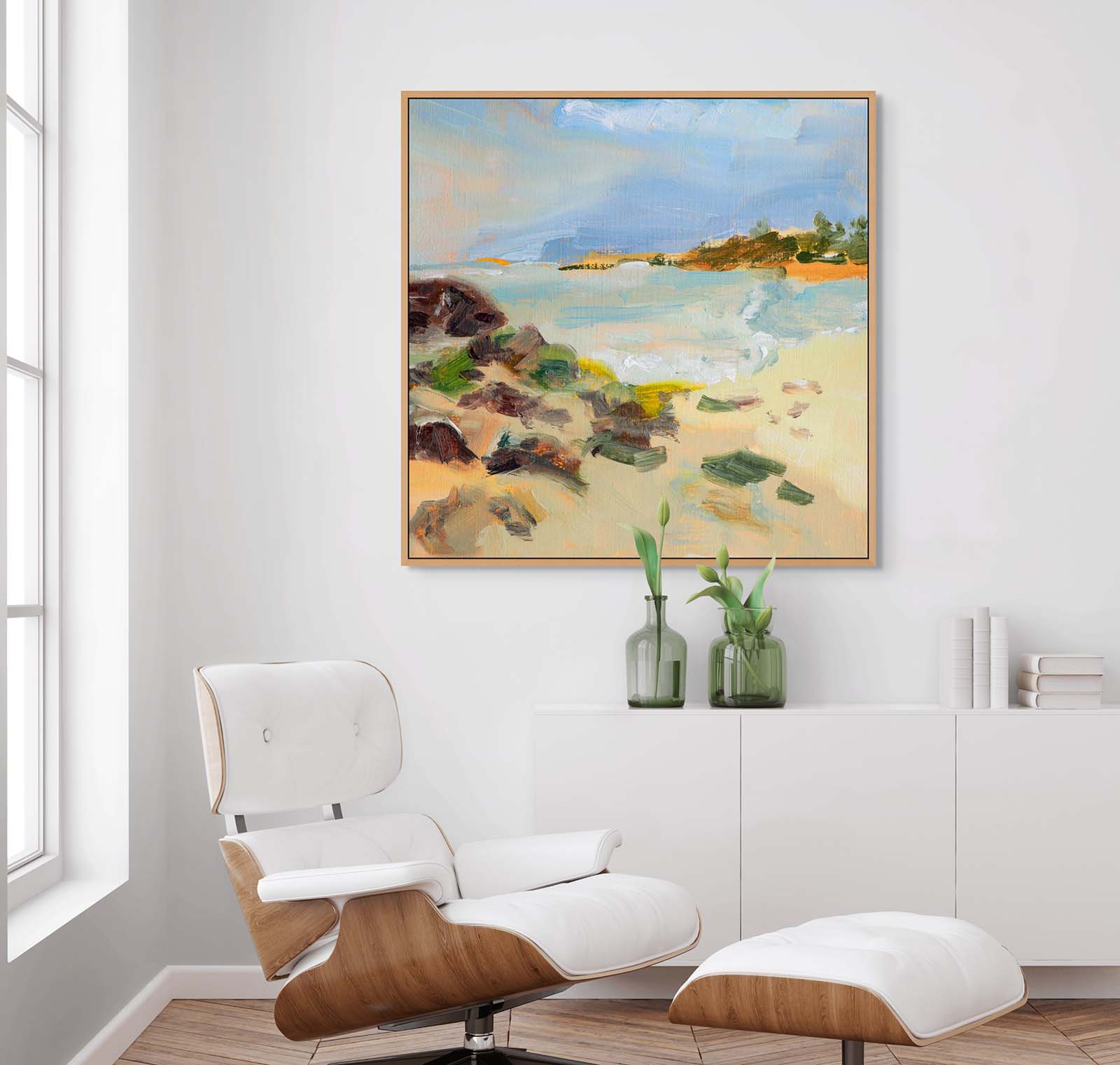 Abstract realism canvas print of beach painting on the wall in a modern living room with a white armchair.