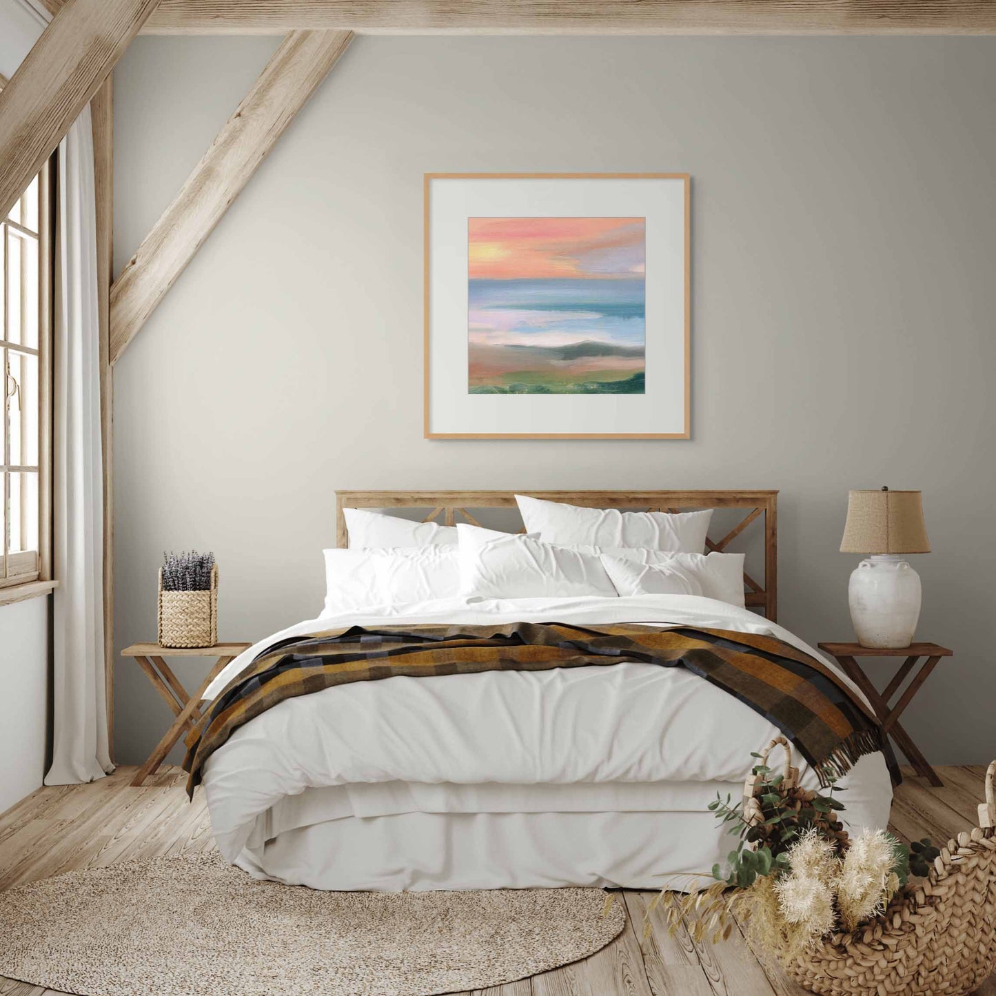  Framed artwork of sunset on wall above master bed in a cozy bedroom with wooden and white decoration.