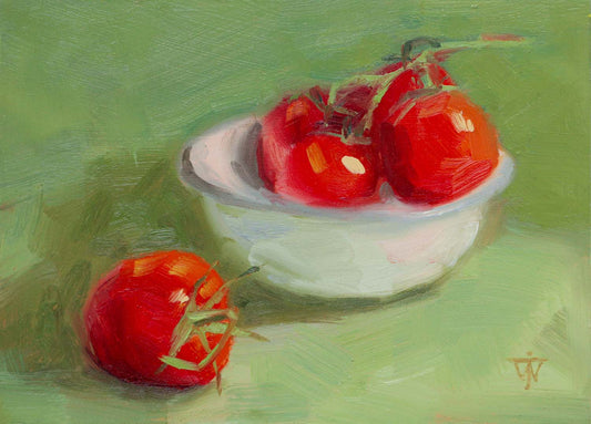 Tomatoes in vintage enamel bowl on green background, perfect food art for kitchen.