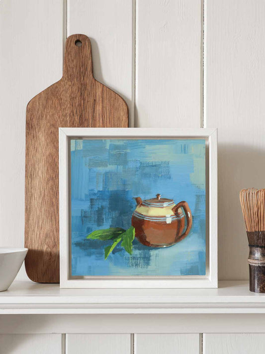 Vintage brown teapot painting in white tray frame displayed on kitchen shelf