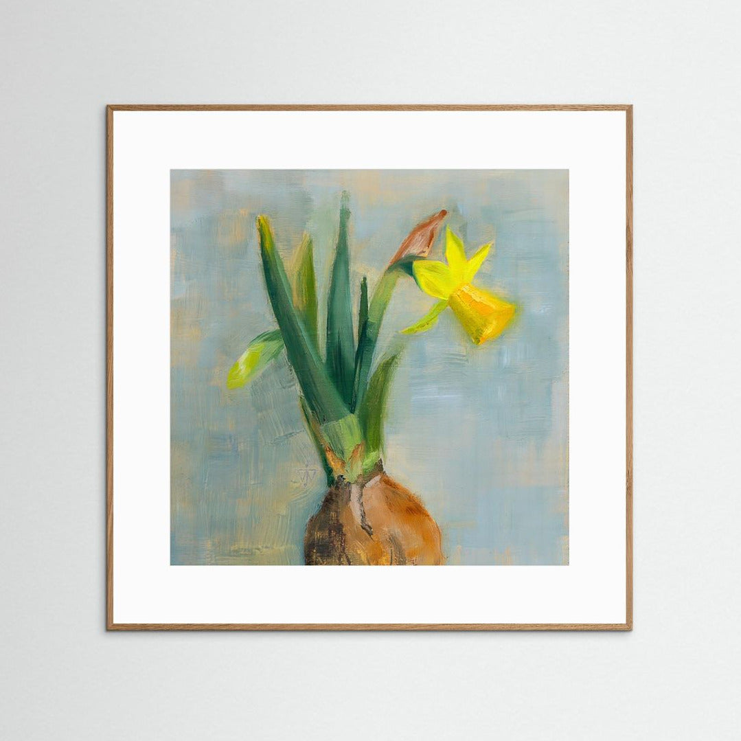 Framed artwork of a yellow flower with bulb on a light gray background