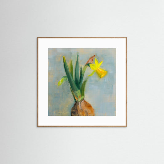 Framed artwork of a yellow flower with bulb on a light gray background